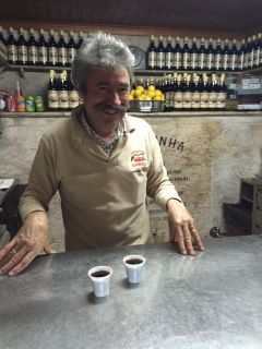 Ginjinha bartender selling Cherry Liquor near Rossio Square
