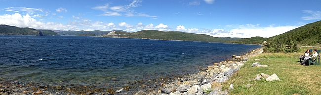 Peter and Monica enjoying an afternoon snack while looking out over Bonne Bay in Gros Morne National Park
